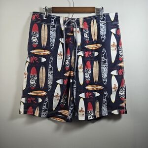 Nautica Blue and Red Swim Trunks with Surfboard Design